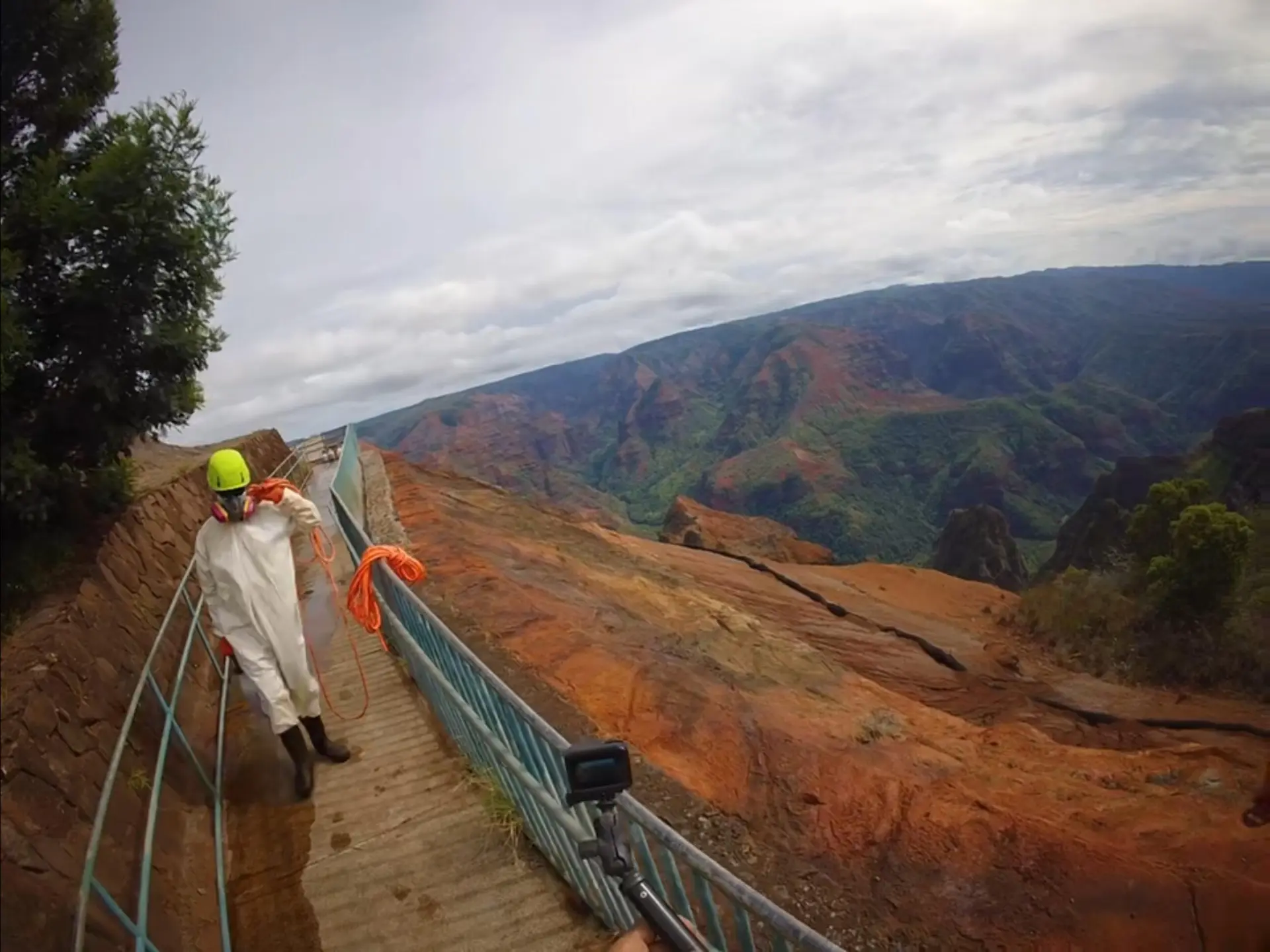 Worker on a walkway overlooking Waimea Canyon