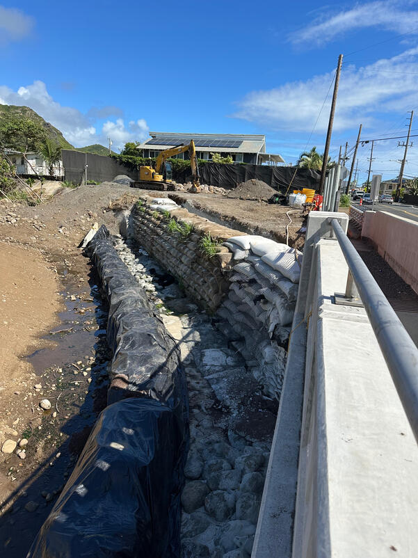 Elevated view of the channel and reinforced embankment at Hauula Bridge
