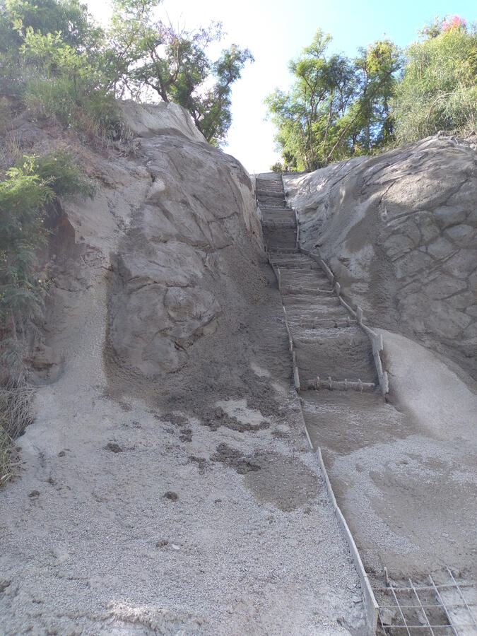 Close view of the finished concrete slope and central channel at the Board of Water Supply project