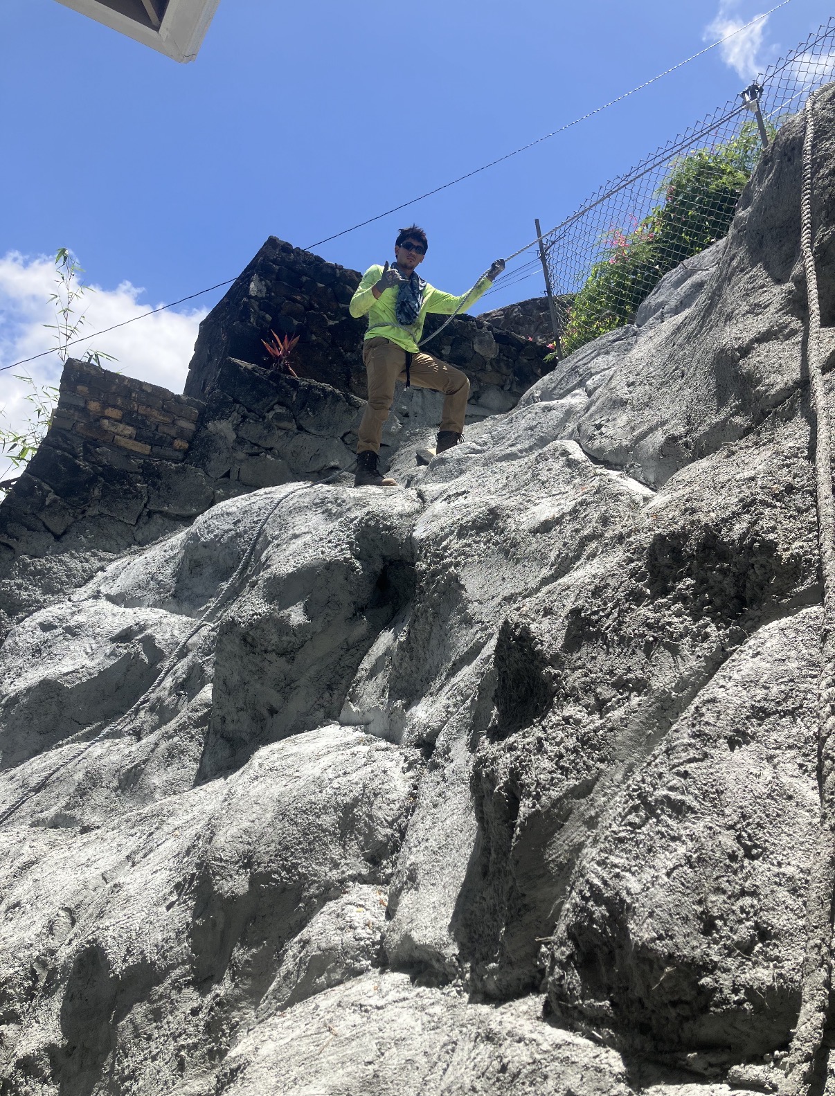Crew member on freshly placed shotcrete high on the Pacific Heights hillside